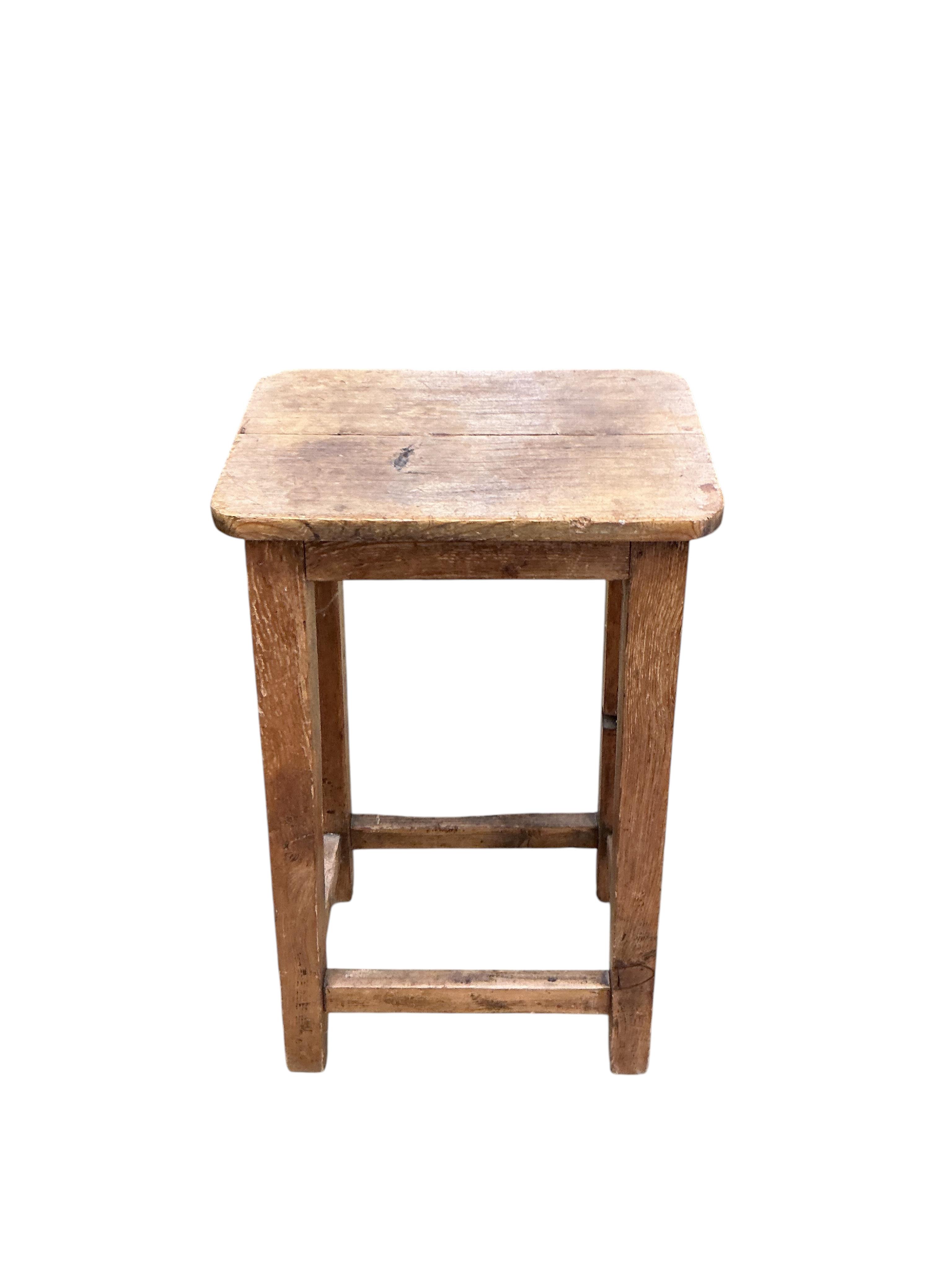 A Victorian pine bedside cabinet, width 38cm, depth 35cm, height 82cm, together with two pine and beech Provincial stools
